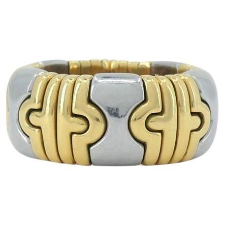 Vintage Bvlgari Parentesi 18k Gold Steel Flex Ring: About the Item This Bvlgari ring from the 1980s is part of the brand's Parentesi collection, a design inspired by architectural motifs and Roman heritage. Crafted in 18k yellow gold, the ring