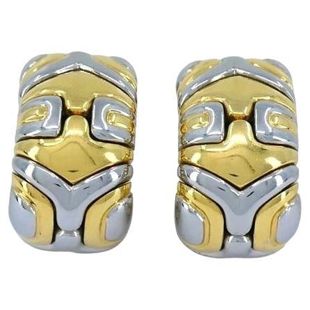 Vintage Bvlgari Alveare 18k Two-tone Gold Clip Earrings: About the Item This pair of Bvlgari earrings from the 1980s is part of the brand's Alveare collection, known for its bold and structured designs. They are crafted from a combination of 18k white and