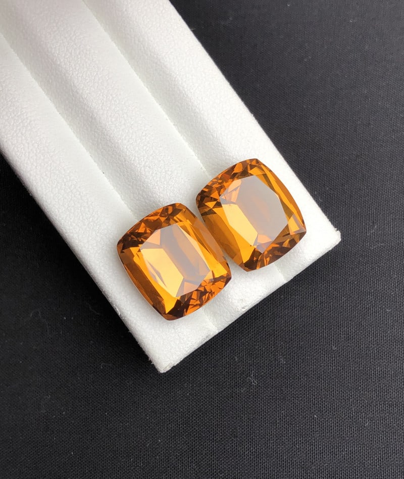 22.30 Carats Natural Citrine Cushion Cut Pair Gemstone: Details SKU ct04 Dimensions (mm) 14 x 13 x 9 mm Weight (cts) 22.3 Treatment Heat Treatment Shape Cushion Type Faceted Clarity N/A Colours Description Madeira Citrine and Chevron