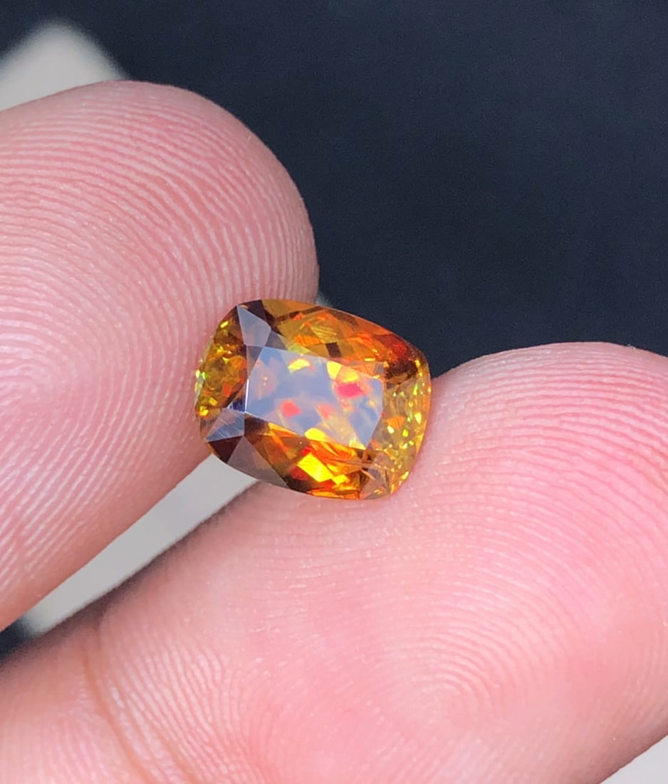 1.95 Carat Rainbow Fire Natural Sparkling Sphene Gemstone For Ring Stone: Details SKU Uz Dimensions (mm) 8.3 x 6.5 x 4.4 mm Weight (cts) 1.95 Treatment No Treatment Shape Cushion Type Faceted Clarity VVS Colours