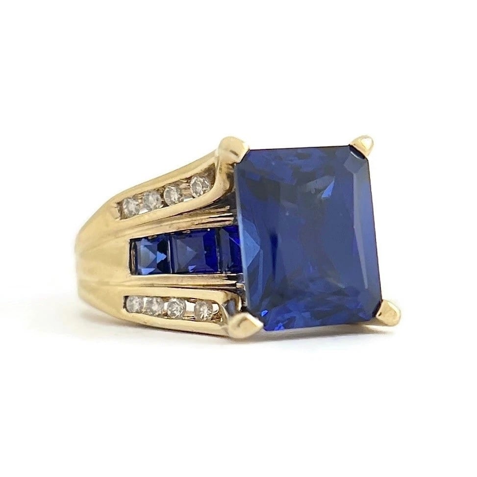 Vintage Blue Gemstone Diamond Cocktail Statement Ring 10K Yellow Gold, 6.24 Gr: Blue Gemstone Diamond Cocktail Statement Ring 10K Yellow Gold, 6.24 Gr This ring is a beautiful statement ring! Please let us know if you have any questions. Gemstones: 3.65 ctw; 1 rectangle blue