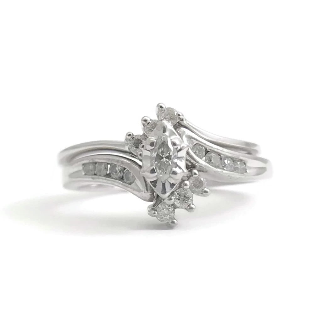Vintage Marquise Diamond Engagement Ring Set 10K White Gold, .22 CTW, 3.59 Grams: Vintage Marquise Diamond Engagement Ring Set 10K White Gold, .22 CTW, 3.59 Grams This is a lovely ring that could be worn as an engagement ring or statement ring. Please let us know if you have any