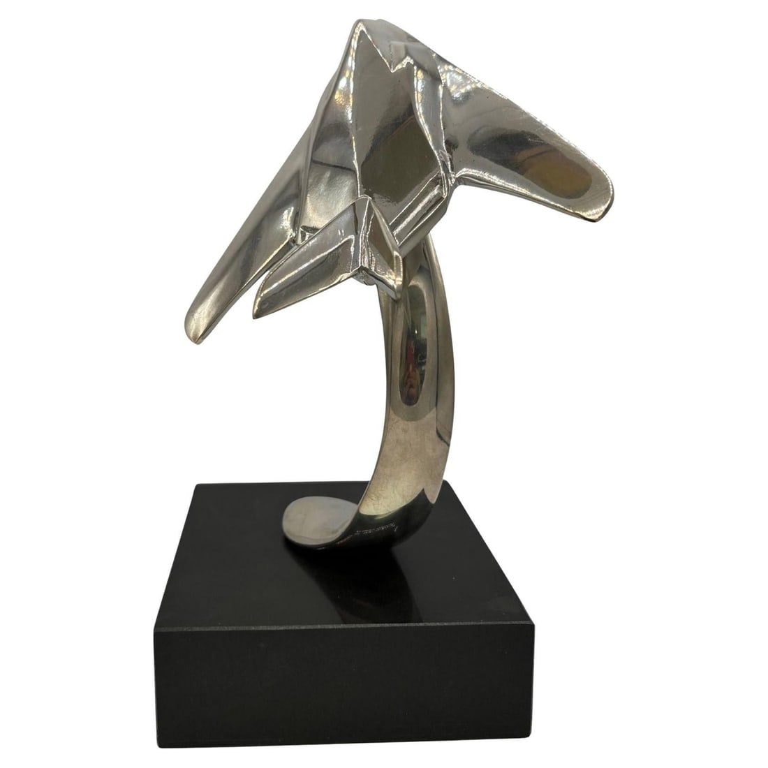 1980s Modernist Lockheed F-117 Nighthawk Chrome Sculpture w/ Black Granite Base: Title: 1980s Modernist Lockheed F-117 Nighthawk Chrome Sculpture w/ Black Granite Base Description: Striking chrome-plated steel sculpture of the famous Lockheed F-117 Nighthawk stealth jet fixed to