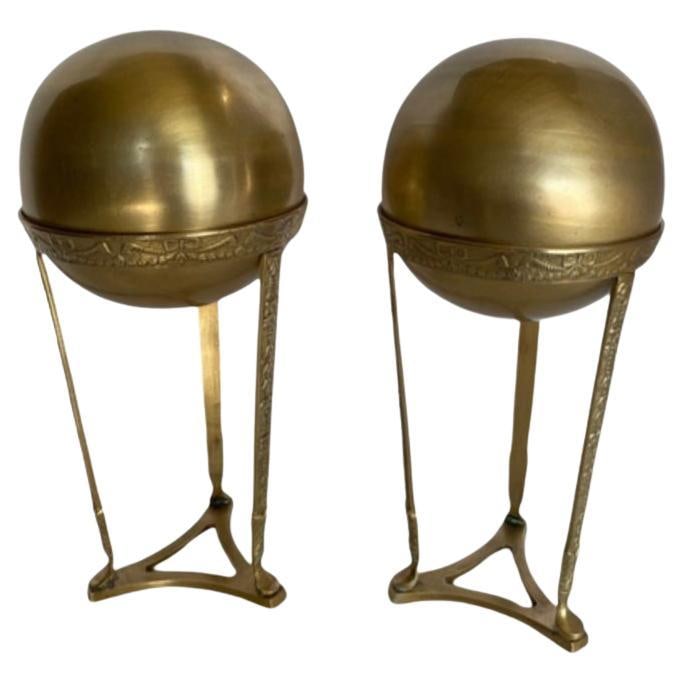 Art Nouvea Style Pair of Embossed Brass Crystal Orb and Pedistals: Title: Art Nouvea Style Pair of Embossed Brass Crystal Orb and Pedistals Description: A pair of embossed brass crystal ball pedestals exude understated elegance. Crafted from gleaming brass, each