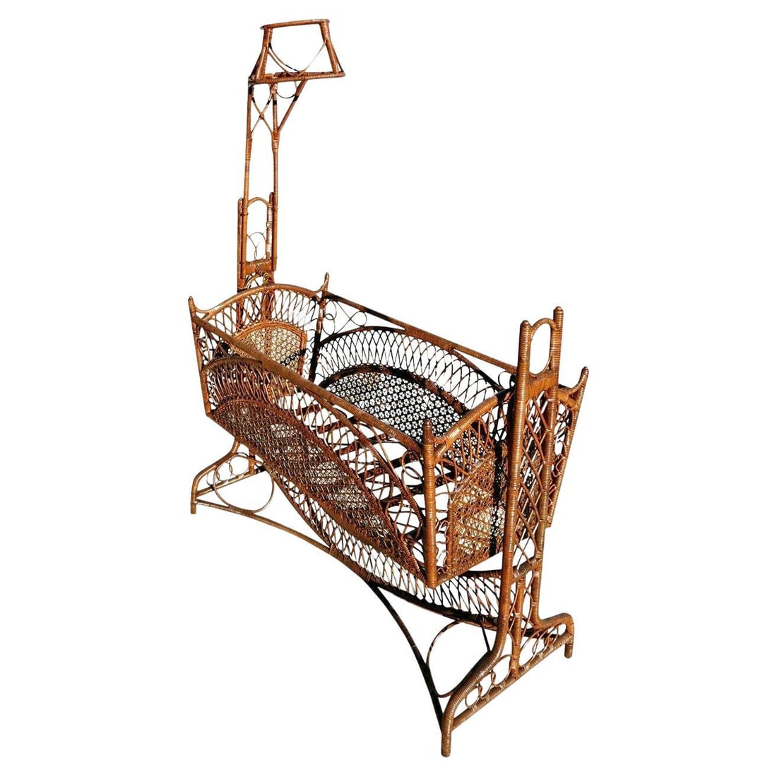 Restored Late Victorian Wicker & Bamboo Swinging Cradle: Title: Restored Late Victorian Wicker & Bamboo Swinging Cradle Description: This dark-stained Victorian wicker, rattan, and bamboo cradle possess intricate patterns that give it an almost Gothic