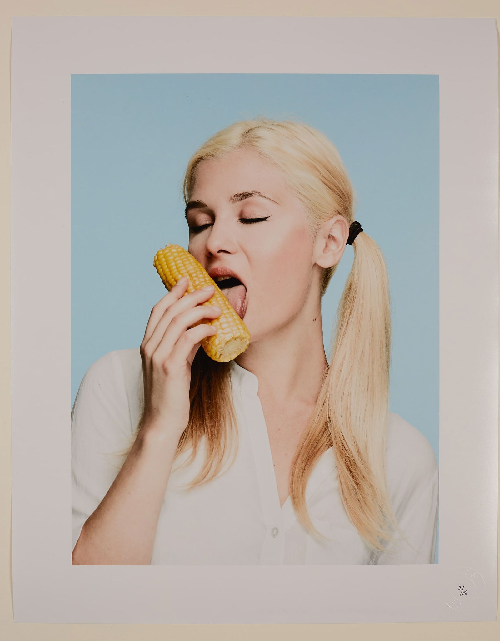 Olya and Corn: Artist: Spiros PolitisTitle:Olya and CornDate/Period: 2016Materials:Size:20" x16"Description:Humourous C-type print of Olya.Paper size - 20" x 16" (50.80cm x 40.64cm). Posted in a hard tube with