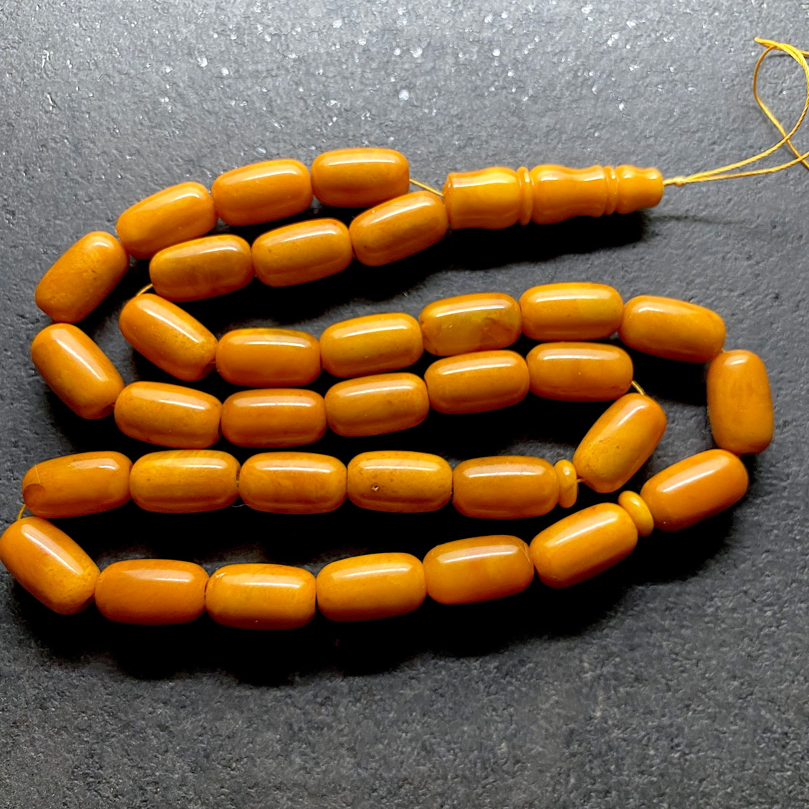 Phenomenal Amber Tesbih made from Barrel shaped Amber beads: Title:Phenomenal Amber Tesbih made from Barrel shaped Amber beadsMetal:NoneGemstone:AmberWeight:57.8 gSize:Bead size: 19.1 x 11.0 mm Bead size: 0.752 x 0.433 inches Made of:(Reconstituted Amber or