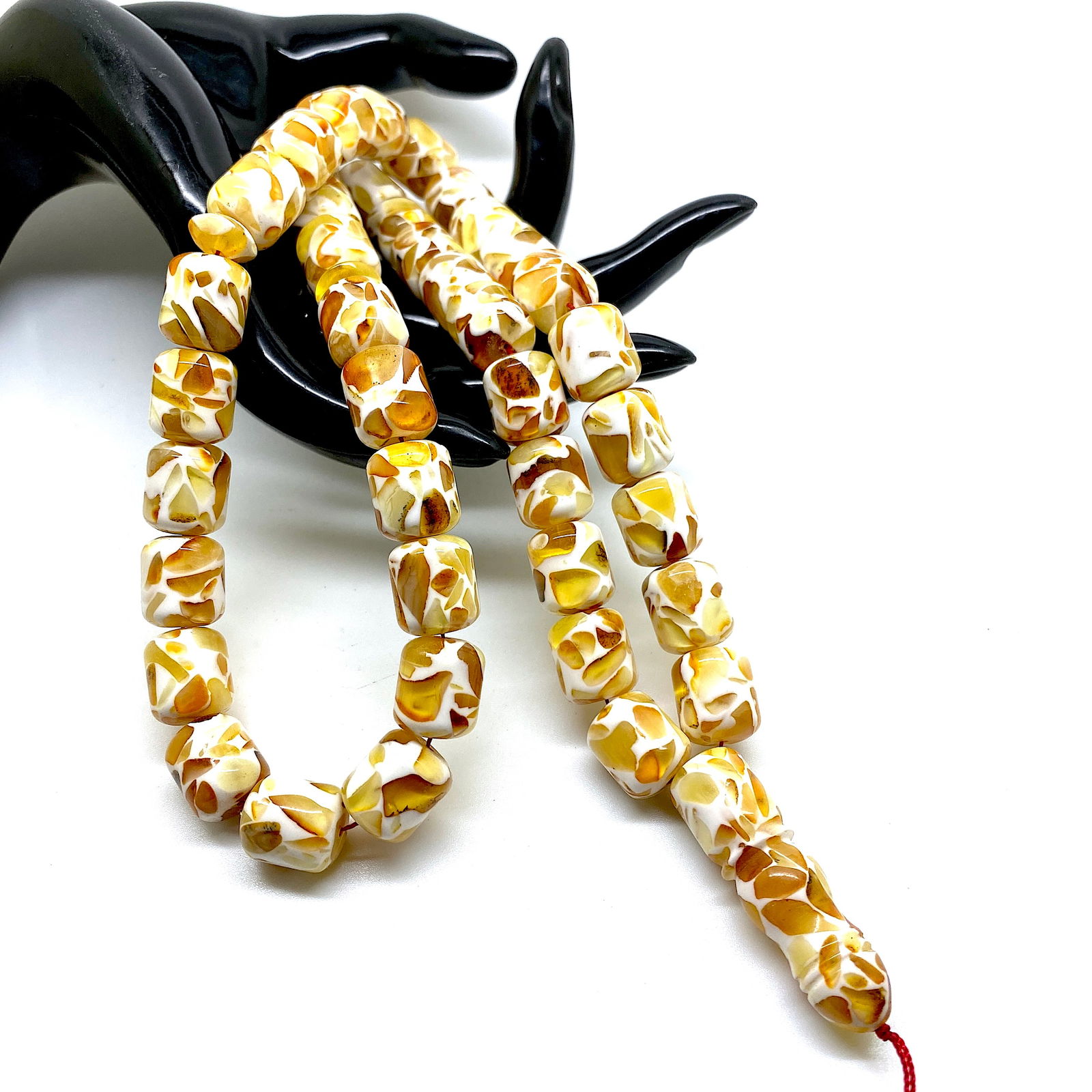 Unique and Phenomenal Amber Tesbih made from Barrel shaped Amber beads: Title:Unique and Phenomenal Amber Tesbih made from Barrel shaped Amber beads Metal:None Gemstone:Amber Weight:65.53 g Size:Bead size: 15.0 x 12.0 mm Bead size: 0.591 x 0.472 inches Made of:(Reconstitu