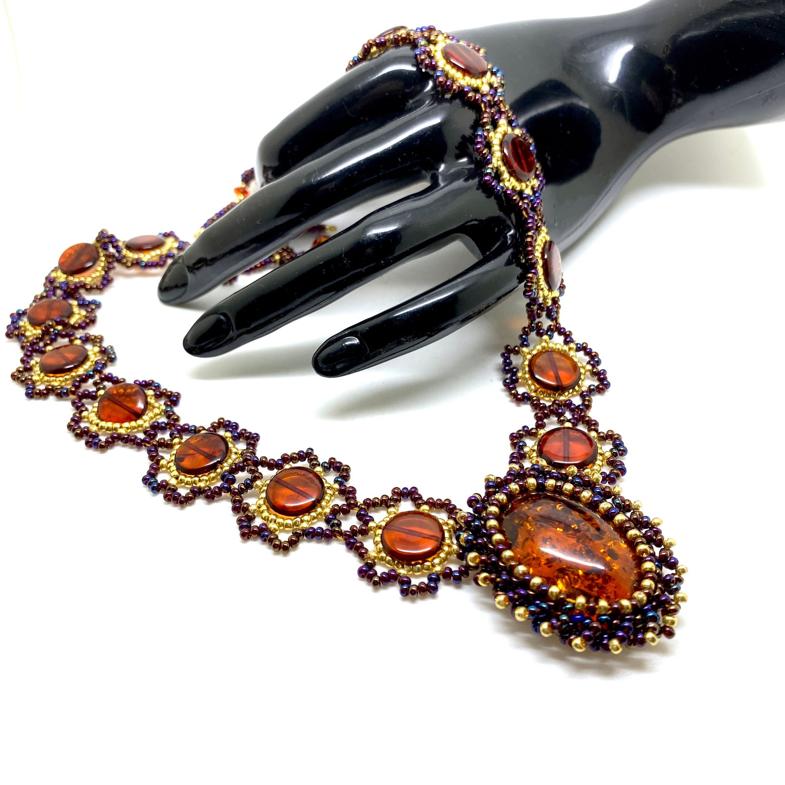 Unique and Grand Amber Floral Necklace made from leaf like bead ornaments: Title:Unique and Grand Amber Floral Necklace made from leaf like bead ornaments Metal:NoneGemstone:AmberWeight:29.27 gSize:Size: 500.0 x 40.0 x 10.0 mm Size: 19.685 x 1.575 x 0.394 inches Made