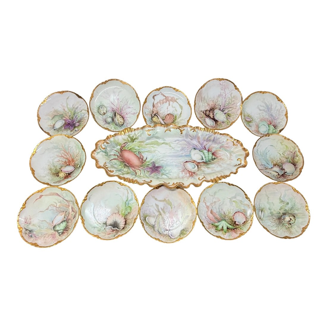 Exceptional 13 Pc, Porcelain Seafood Service by Haviland Limoges Circa. 1890: This exquisite seafood service set, produced by the renowned Haviland & Co. of Limoges, France, dates from 1888 to 1896. Known for their unparalleled porcelain quality and artistic hand-painted