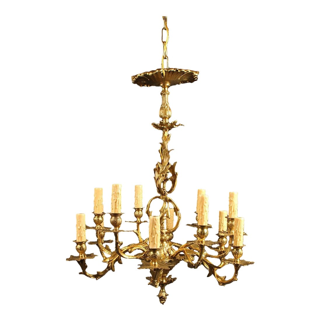 French Bronze 12-Arm Chandelier With Acanthus Leaf & Foliage Castings, Circa 1890: French cast bronze chandelier featuring decorative castings depicting foliage. Late 19th century, circa 1890. The chandelier displays acanthus leaf motifs and is finished with a bottom finial in the