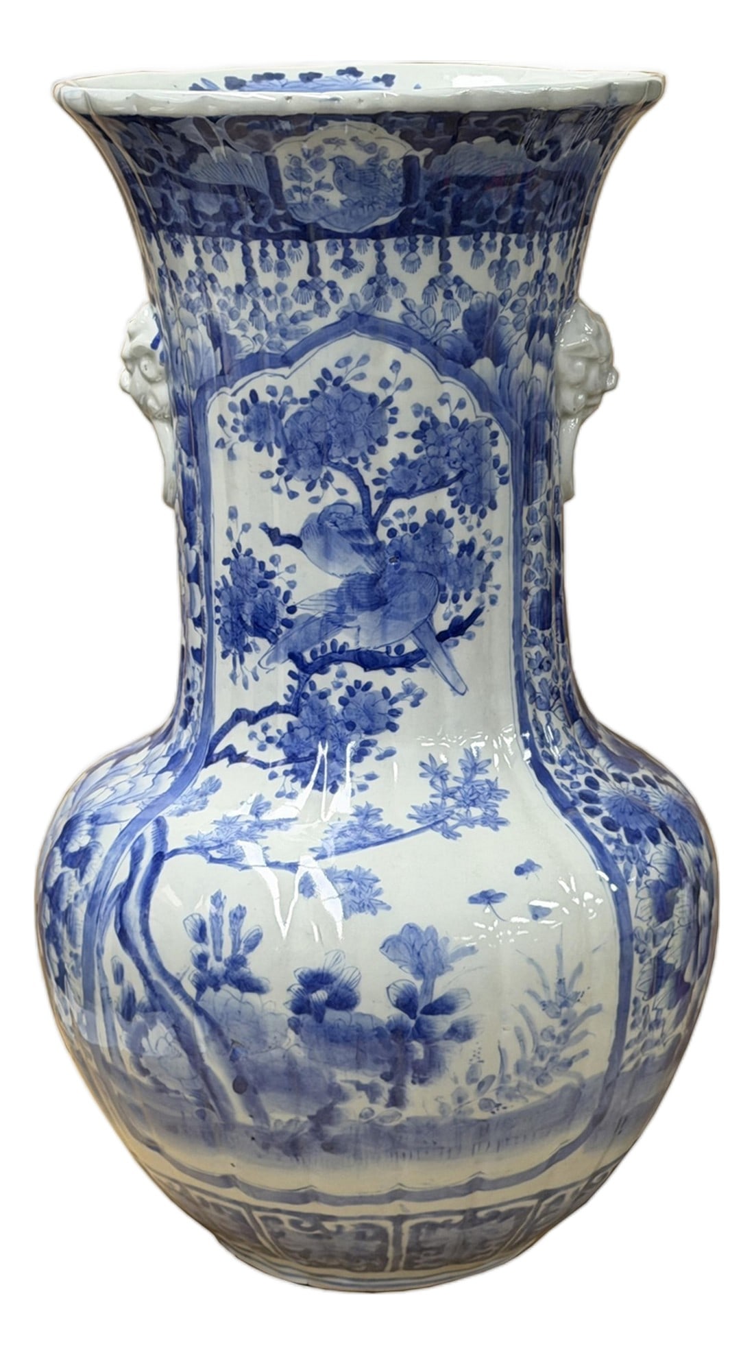 Oriental Pale Blue & White Porcelain Bulbous Shape Flower Vase: This striking blue and white porcelain vase showcases a classic baluster form, characterized by a bulbous, lobed body that tapers into a wide, flaring neck and a scalloped rim. The vessel is densely