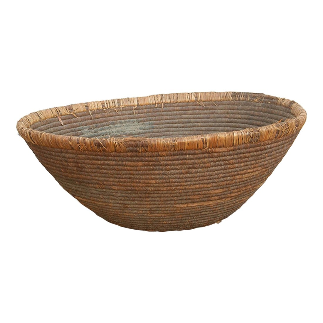 Large Antique Nomadic Harvest Bowl: This massive, nomadic harvest bowl is a stunning piece of utilitarian history. Long before modern storage, oversized, tightly woven baskets like this were the absolute lifelines of rural and nomadic a
