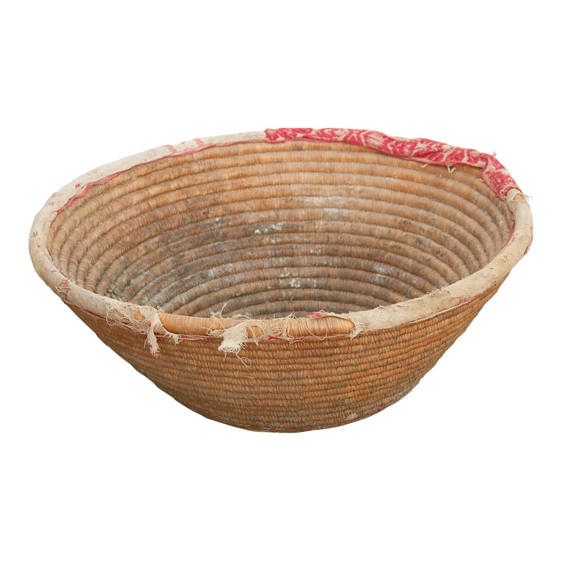 Harvest Basket With Old Textile Rim: This beautifully preserved nomadic harvest bowl is a classic example of everyday tribal craftsmanship. Originally woven as an essential agricultural tool, baskets of this manageable 18-inch scale