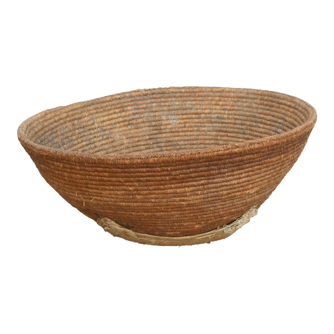 Large 25" Dm Nomadic Basket With Center Patch: At an impressive 25 inches wide, this deep nomadic harvest bowl is a remarkable piece of utilitarian history. In traditional tribal and agrarian societies, large, sturdy baskets of this scale were