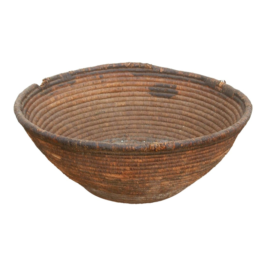 Antique Weathered Patina Harvesting Bowl: This incredibly weathered nomadic harvest vessel is a profound example of wabi-sabi beauty and historic utility. In traditional agrarian communities, sturdy baskets of this 23-inch scale were