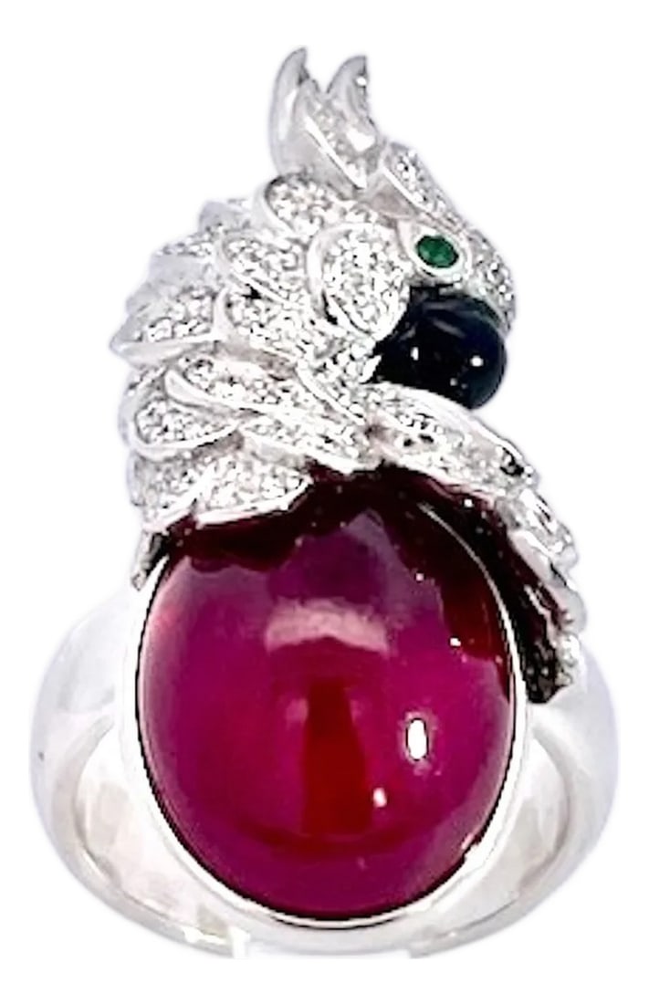 Large Oval Ruby Cabochon and Diamond Parrot Ring, Size 6.5: This extraordinary cocktail ring is a true work of wearable art, showcasing a magnificent large oval ruby cabochon 8 to 10 carats as its centerpiece, displaying a deep, velvety crimson tone with a
