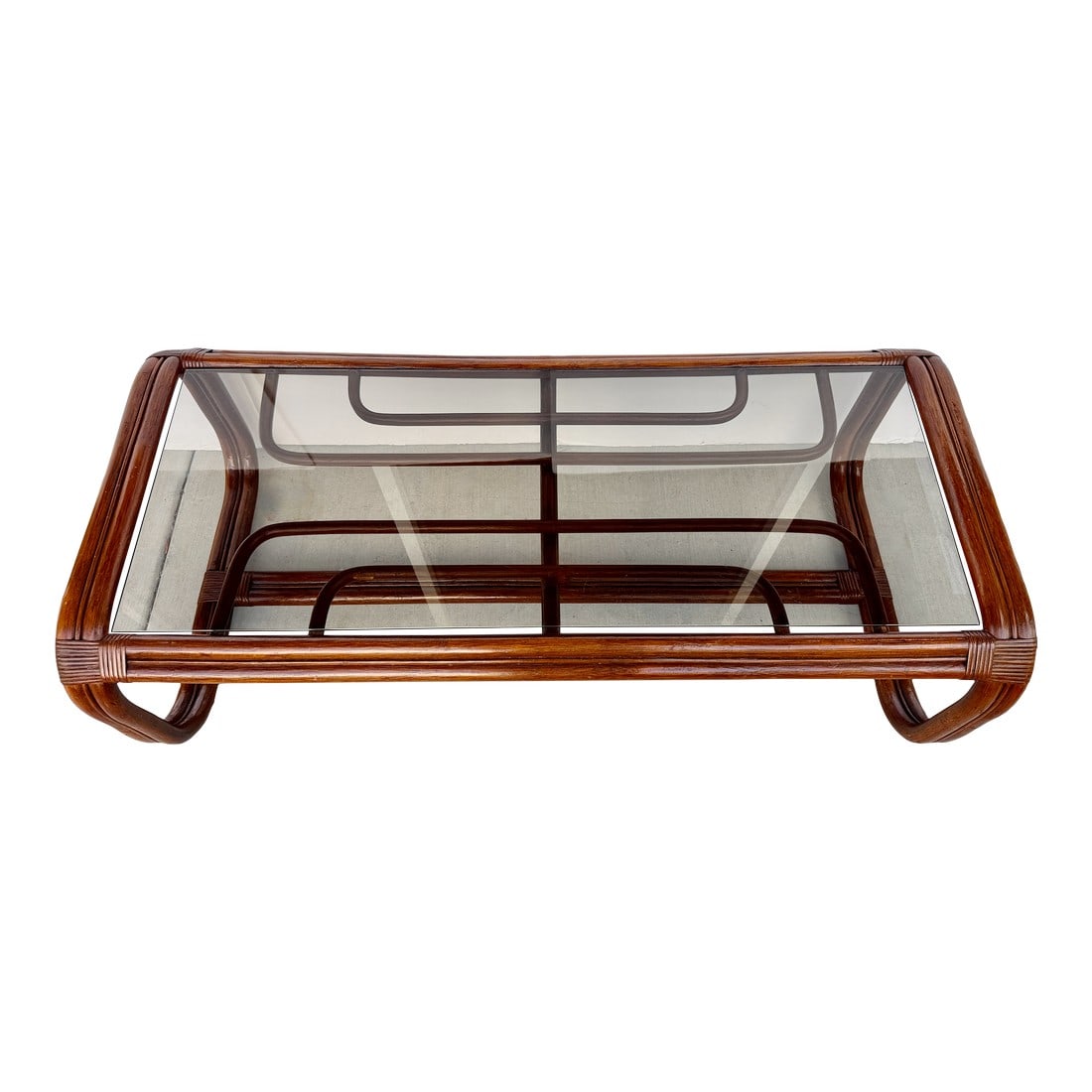 Geometric Bentwood Rattan Coffee Table With Smoked Glass Top From 70's: Stylish vintage 1970s rattan coffee table with smoked glass top. Elegant geometric design. Crafted from natural brown rattan and featuring a unique bentwood design that gives it a casual yet textured