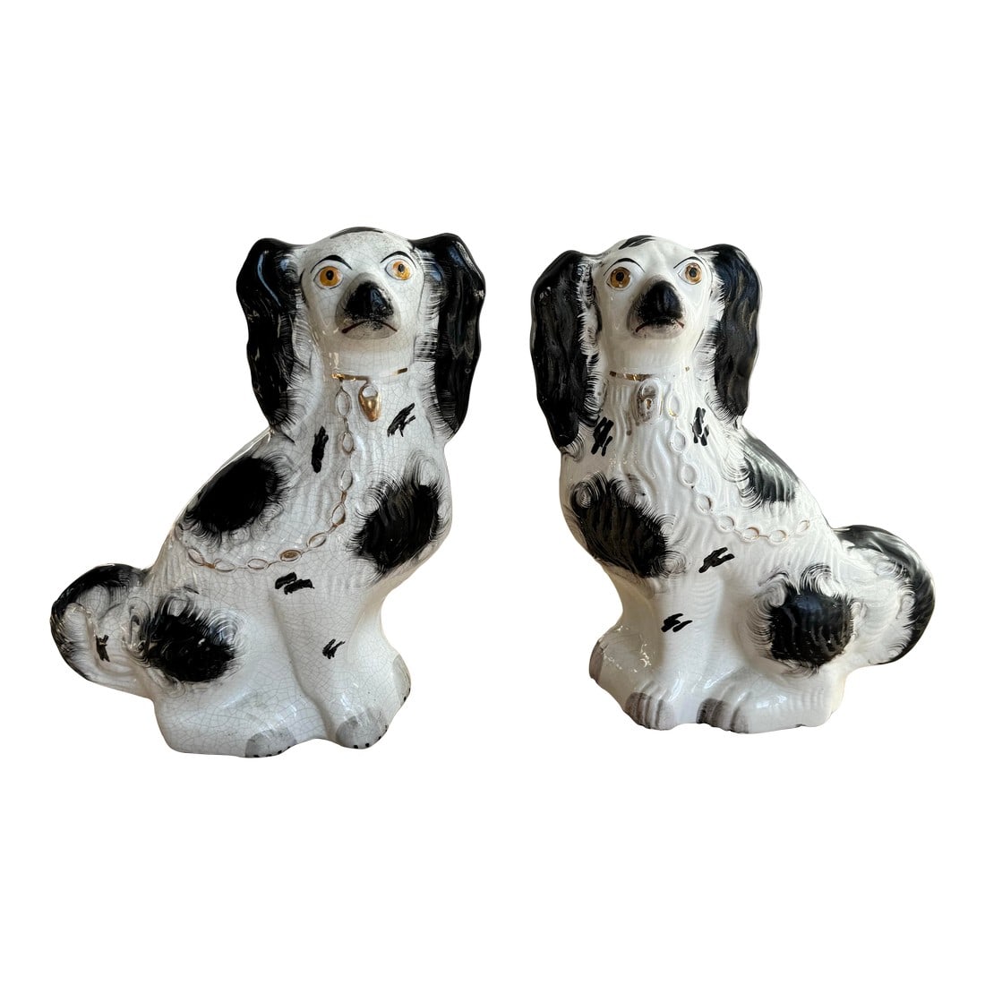 Antique Late 19th Century Large English Staffordshire Black & White Spaniels - A Pair: A charming matched pair of authentic antique Staffordshire "Wally Dug" King Charles Spaniels, dating to the late Victorian era (circa 1890-1910). These hand-painted ceramic mantle dogs feature the cla