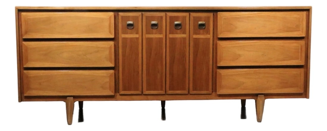 Nine Drawer Mid 20th Century Dresser by American of Martinsville: Elegant and sophisticated Mid Century, Hollywood Regency style low dresser made by American of Martinsville. The dresser features two banks of three drawers, which flank two doors that open to reveal