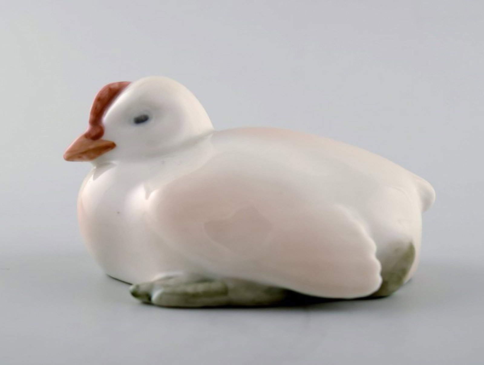 Royal Copenhagen figure of chicken # 266.: Title: Royal Copenhagen figure of chicken # 266. Description: Royal Copenhagen figure of chicken # 266. Measures 8.5 cm. long. In perfect condition. 1. factory quality. Reserve: $119.00 Shipping: Dome