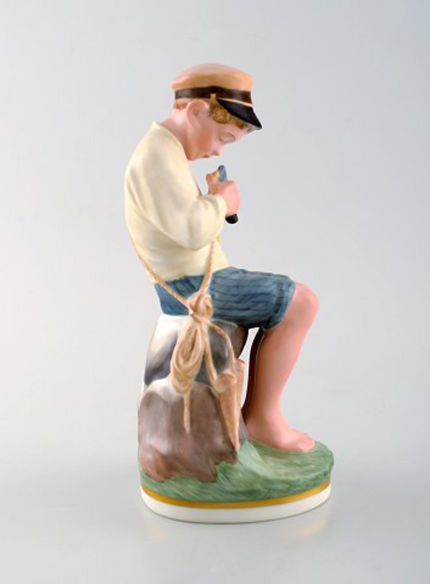 Royal Copenhagen porcelain figurine in high quality over glaze. Young boy. Model number 905. Dated - 3