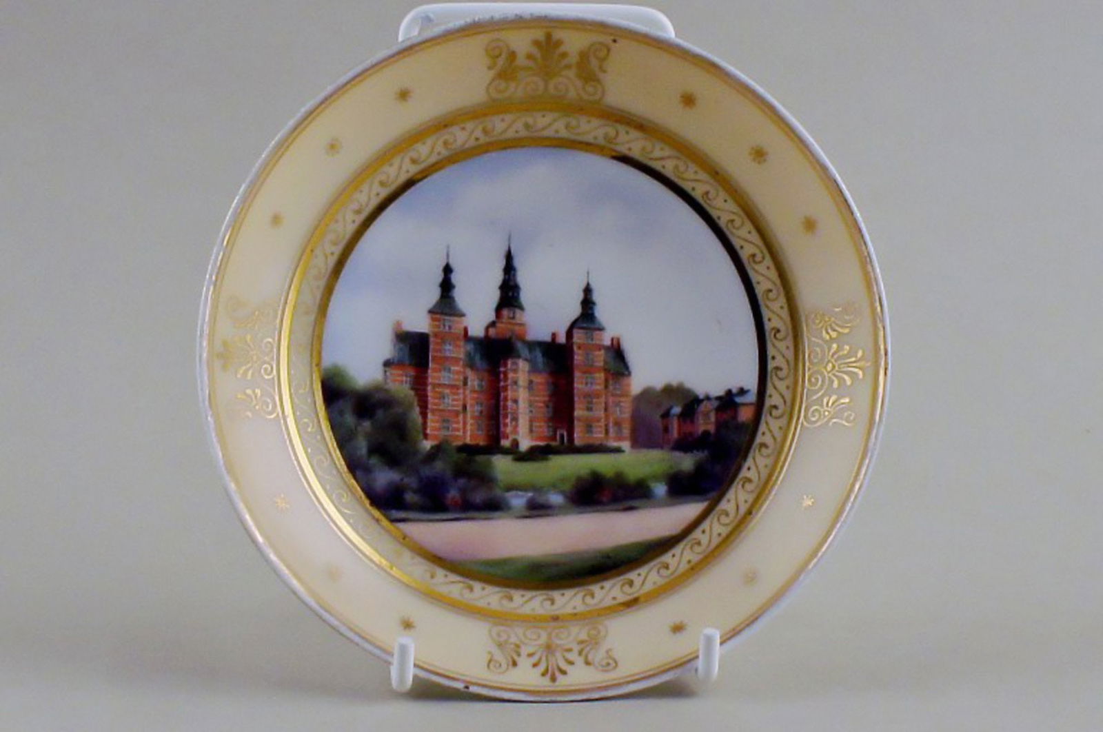 Antique Royal Copenhagen plate with motif of Rosenborg in overglaze technique.: Title: Antique Royal Copenhagen plate with motif of Rosenborg in overglaze technique. Description: Antique Royal Copenhagen plate with motif of Rosenborg in overglaze technique. Hand painted plate of