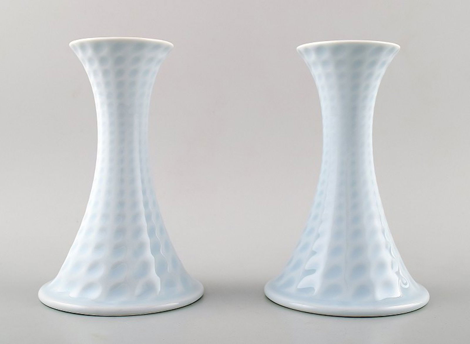 Royal Copenhagen porcelain pair of candlesticks.: Title: Royal Copenhagen porcelain pair of candlesticks. Description: Royal Copenhagen porcelain pair of candlesticks. Beautiful glaze in light blue shades. Stamped. 2nd factory quality, in very good