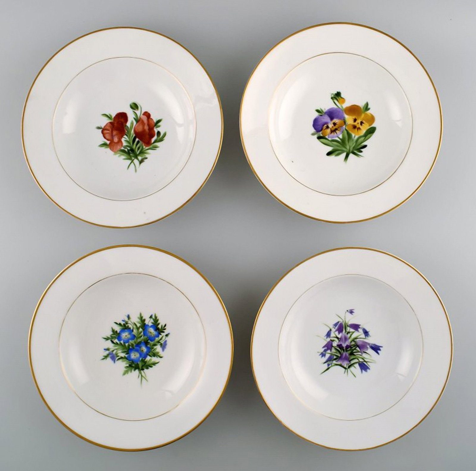 4 antique Royal Copenhagen deep plates in flora danica style.: Title: 4 antique Royal Copenhagen deep plates in flora danica style. Description: 4 antique Royal Copenhagen deep plates in flora danica style. Measures: 22.5 cm. X 5 cm. In excellent condition. 1st.