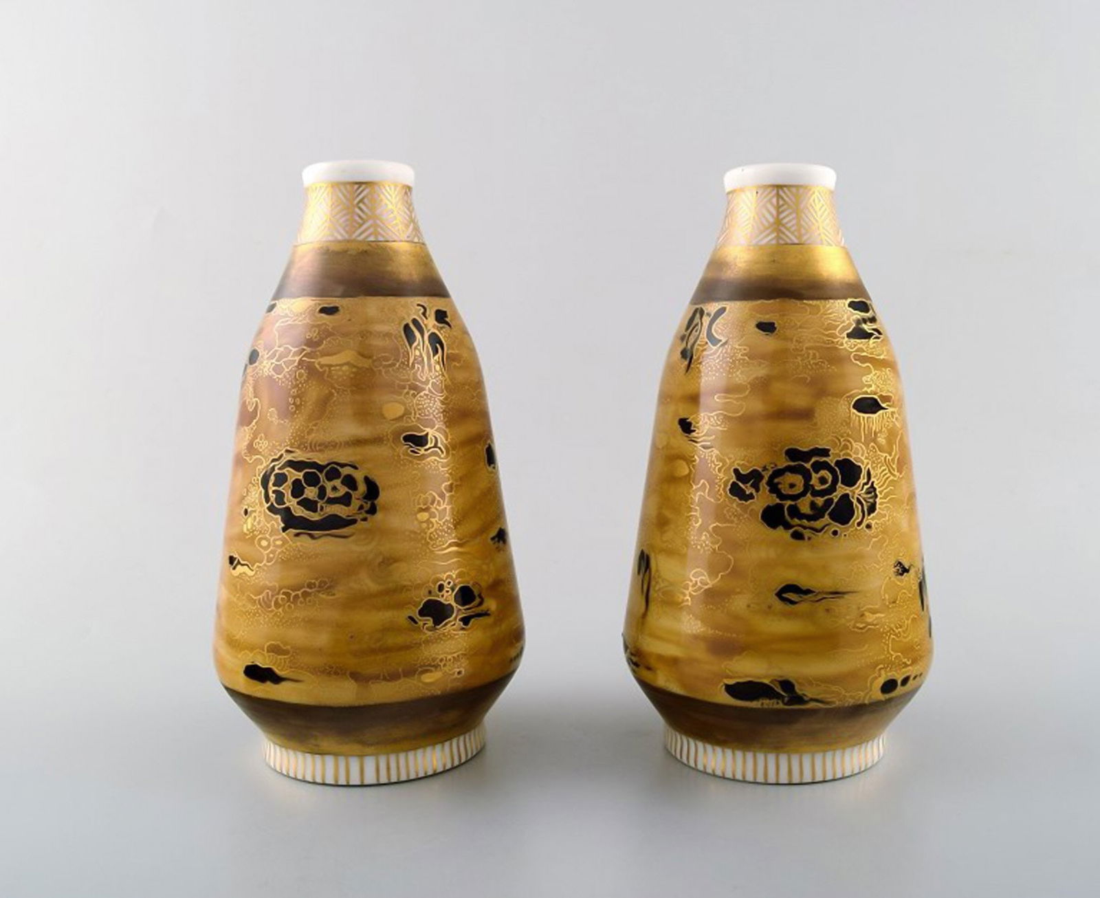 Theodor Larsen for Royal Copenhagen. A pair of porcelain vases decorated in gold and black.: Title: Theodor Larsen for Royal Copenhagen. A pair of porcelain vases decorated in gold and black. Japanism. Description: Theodor Larsen for Royal Copenhagen. A pair of porcelain vases decorated in go