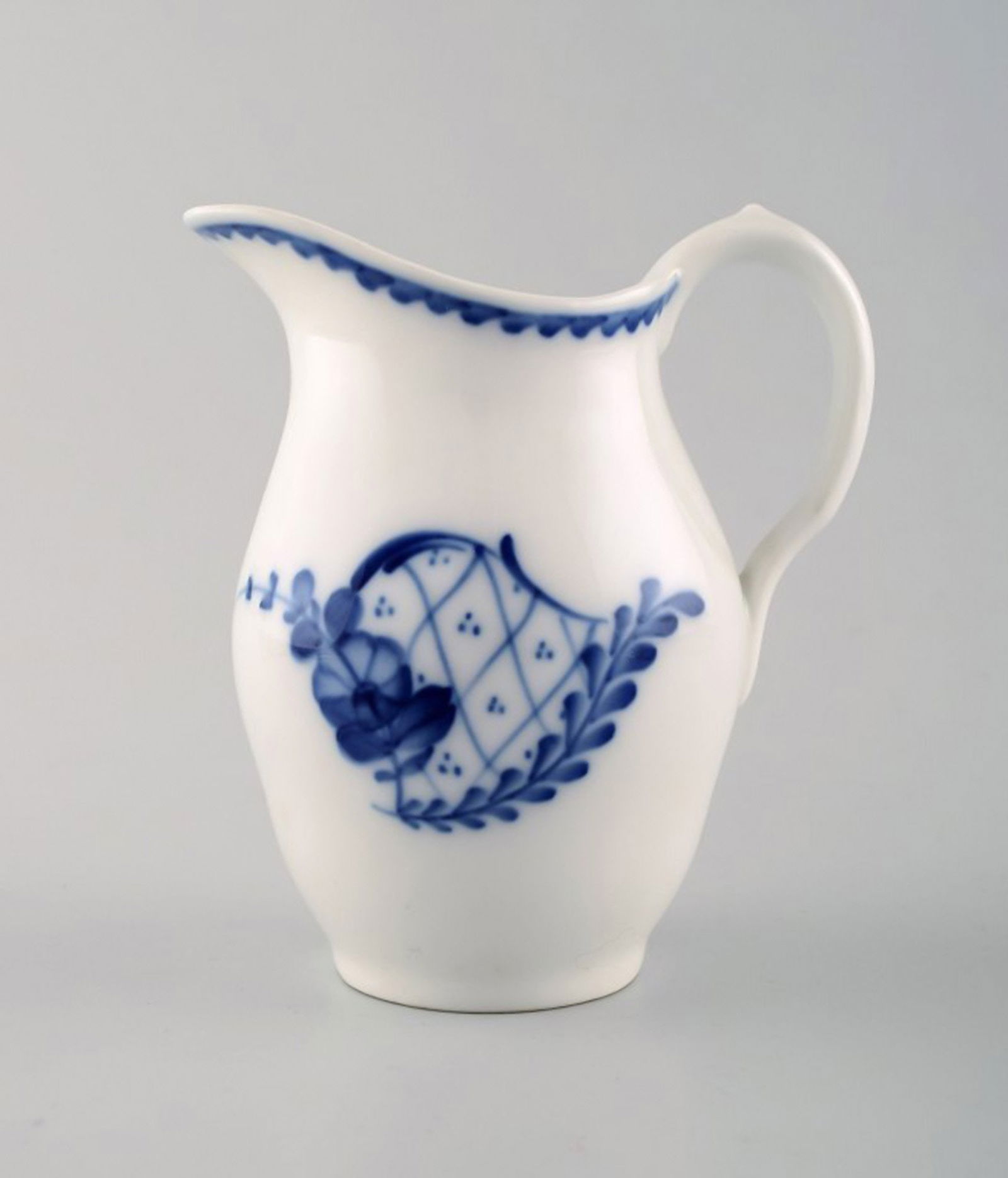 Royal Copenhagen Rococco creamer.: Title: Royal Copenhagen Rococco creamer. Description: Royal Copenhagen Rococco creamer. Decoration Number 608/8026. Measures: 12 cm. x 11 cm. Perfect condition. 1st factory quality. Reserve: $35.00 