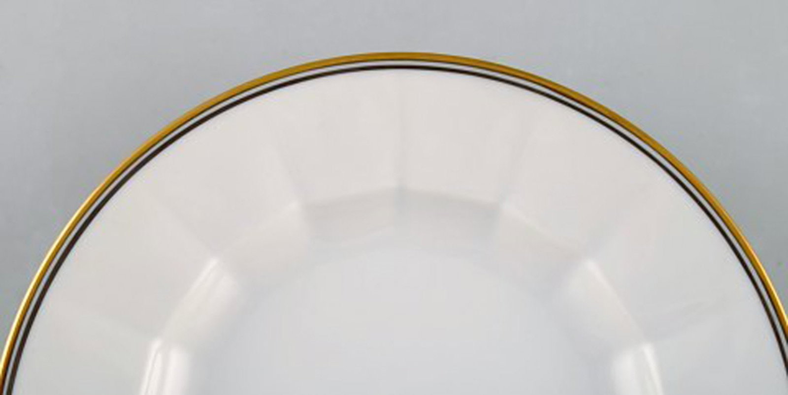 Royal Copenhagen. Three porcelain plates with gold border. - 3