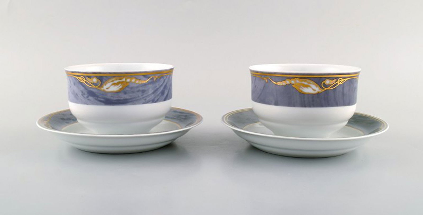 Two Royal Copenhagen Gray Magnolia sauce boats in porcelain. Model number 575. Late 20th century.: Title: Two Royal Copenhagen Gray Magnolia sauce boats in porcelain. Model number 575. Late 20th century. Description: Two Royal Copenhagen Gray Magnolia sauce boats in porcelain. Model number 575.