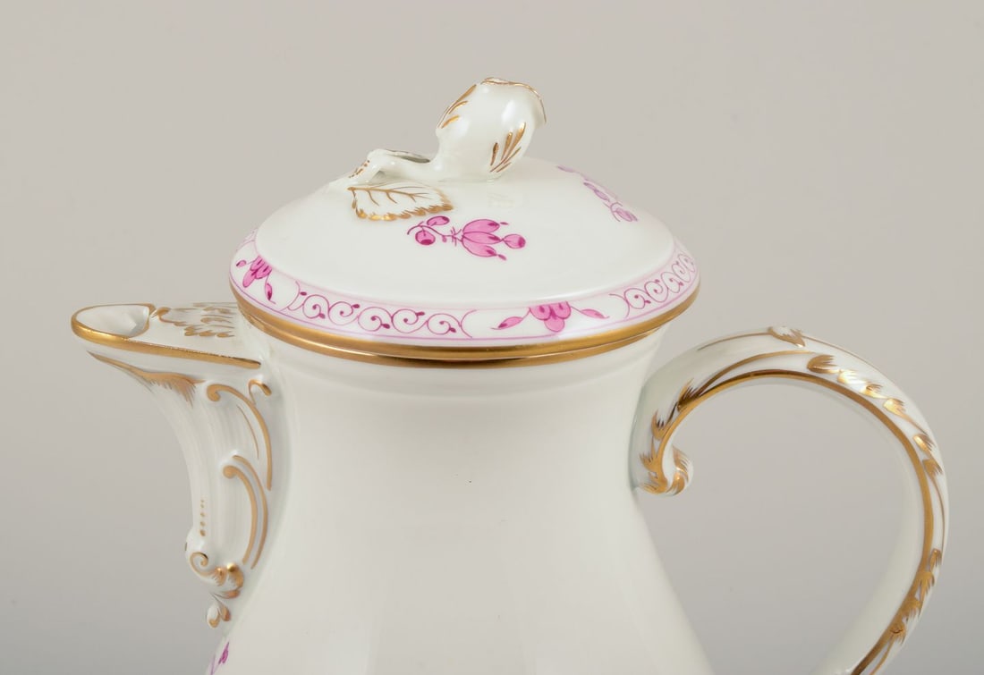 Meissen, Germany. "Pink Indian" porcelain coffee pot with purple floral motifs, gold rim. Mid-20th - 3
