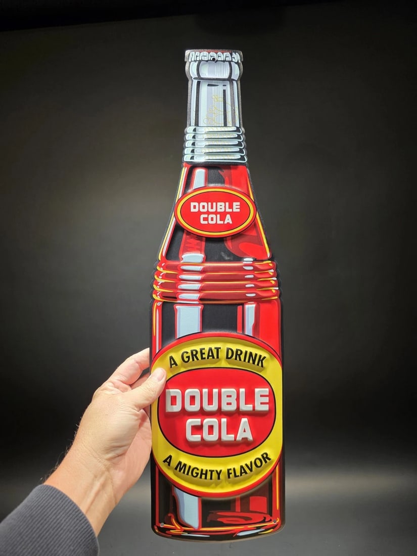 22" Vintage Style Metal Die Cut Double Cola Bottle Sign: Title:22" Vintage Style Metal Die Cut Double Cola Bottle SignDescription:22" Long x 6" Wonderful reproduction Coca Cola sign. Good detail styled to look vintage. Certainly hard to tell its age. 