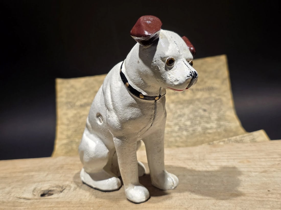 6" Nipper Dog Cast Iron Coin Bank: Title:6" Nipper Dog Cast Iron Coin Bank Description:6" H Great reproduction cast iron Nipper, the famous dog from the HMV (His Master's Voice) logo. It's a special and useful piece for any collector's
