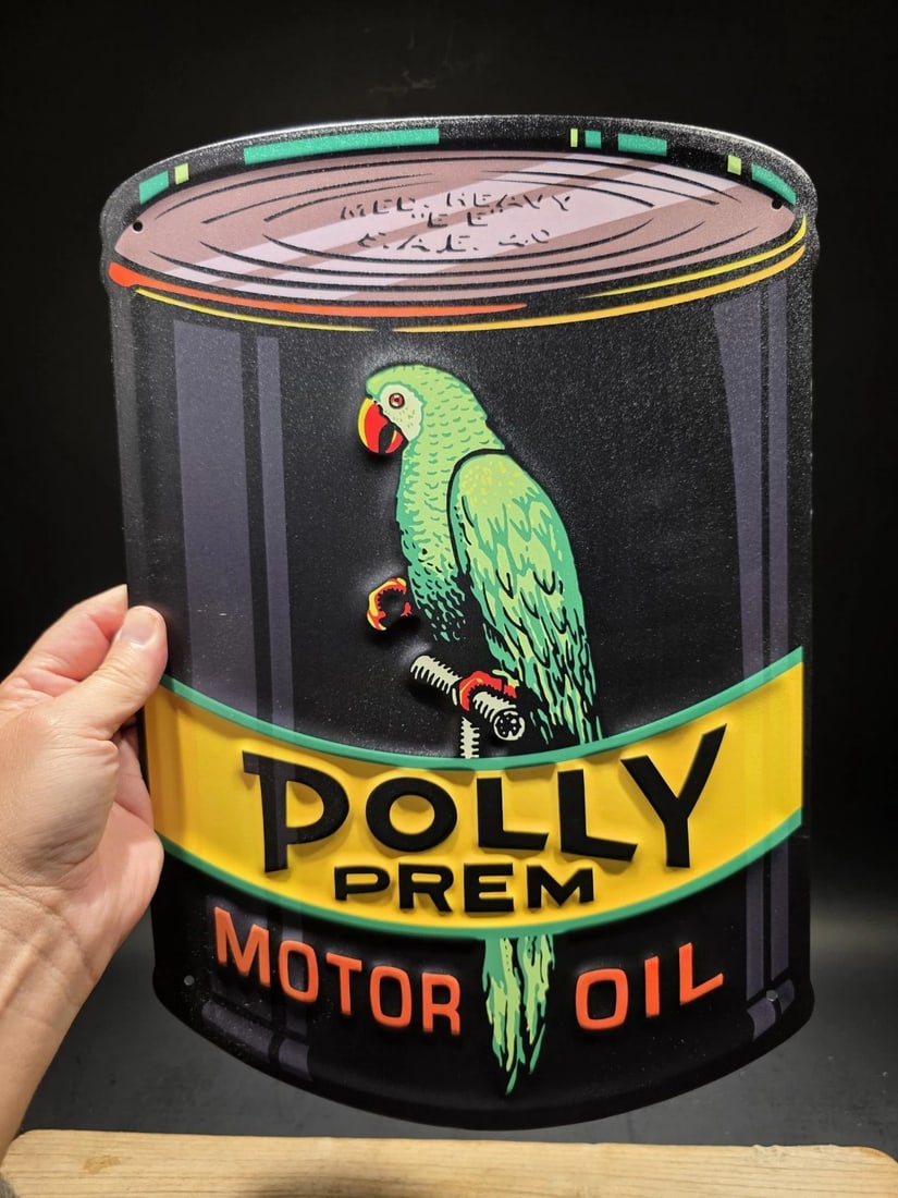 16" Metal Polly Motor Oil Sign: Title:16" Metal Polly Motor Oil SignDescription:16" x 10 3/4" Polly Premium Motor Oil advertising sign designed in the shape of a classic oil can. The design features the well-known Polly motor oil