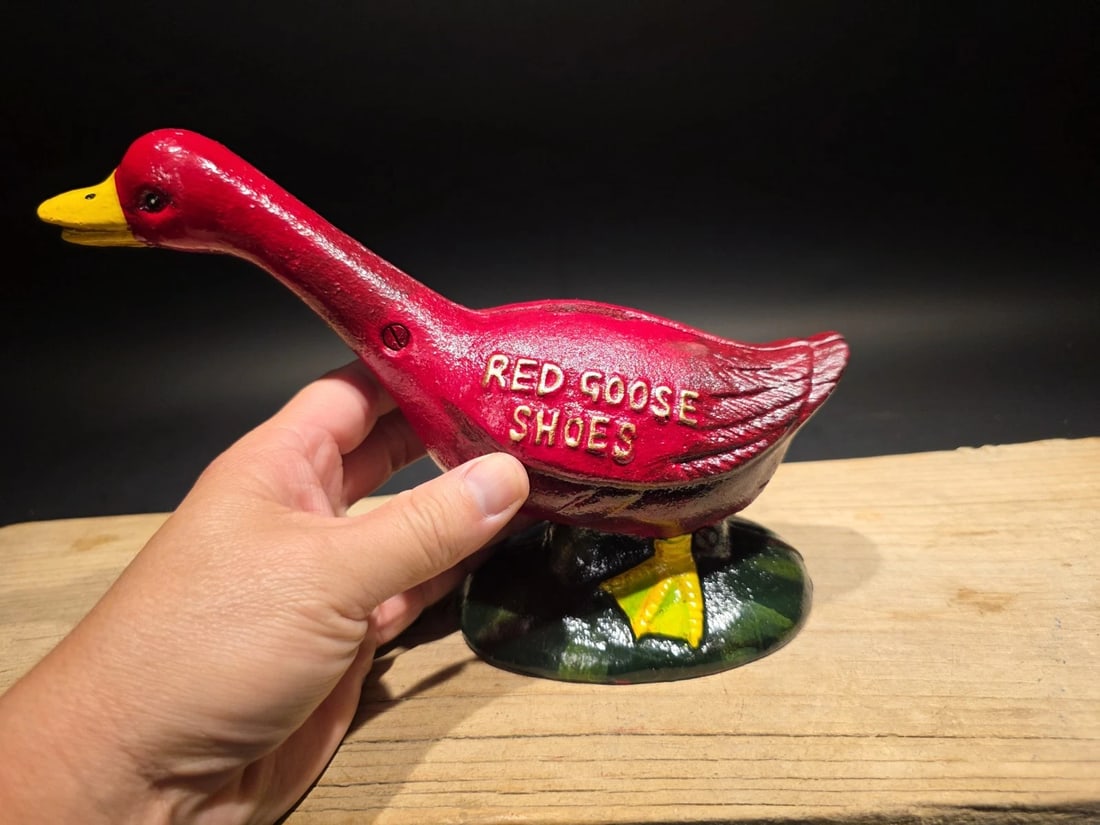 Red Goose Shoes Cast Iron Goose Bank Advertising Bank: Title:Red Goose Shoes Cast Iron Goose Bank Advertising BankDescription:9" Long x 7" Tall Cast iron goose bank featuring the Red Goose Shoes advertising mascot. Red Goose Shoes was a well-known