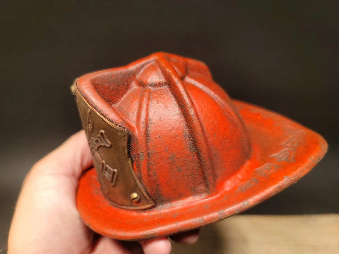 Miniature Cast Iron Fireman Helmet Coin Bank: Title:Miniature Cast Iron Fireman Helmet Coin Bank Description:5 3/4" long x 4 1/2" wide 3 1/4" tall Antique Vintage Style Cast Iron Texaco Fire Helmet. Such a neat reproduction antique fire helmet. T