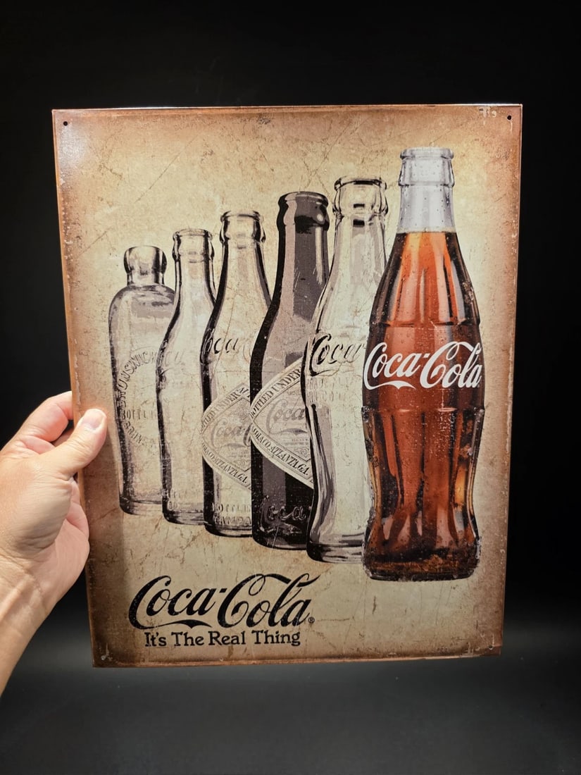 Coca Cola Bottles Sign: Title:Coca Cola Bottles SignDescription:16" x 12 1/2" Such a neat reproduction metal Vintage Style coca cola bottle sign. Great decorative piece. Reserve: $15.00 Shipping:Domestic: Flat-rate of