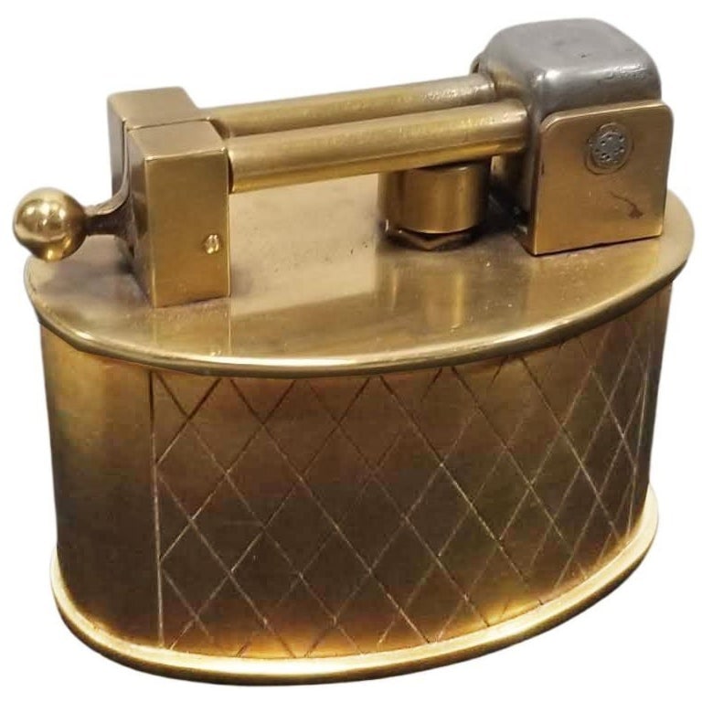 Swiss Brass Lift Arm Tabletop Lighter By Brilux for Dunhill: Title: Swiss Brass Lift Arm Tabletop Lighter By Brilux for Dunhill Description: Circa 1950 Made in Switzerland made by Brilux and distributed by Dunhill. Beautifully made brass lighter with spring
