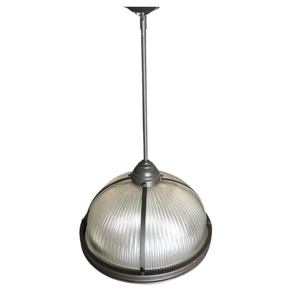 Industrial Ribbed Pendant Lamp Holophane Style Pair: Title: Industrial Ribbed Pendant Lamp Holophane Style Pair Description: Steel industrial style ribbed glass pendant lamp Holophane finished in a dark finish Pair A holophane glass ceiling fixture is a