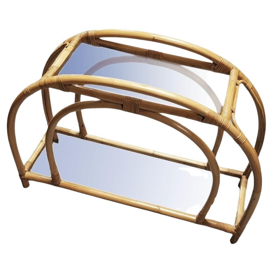 Restored Rattan Double Arched Two-Tiered Single Strand Side Table: Title: Restored Rattan Double Arched Two-Tiered Single Strand Side Table Description: This beautifully restored Paul Frankl-inspired Mid-Century rattan double arched two-tiered glass shelf side table