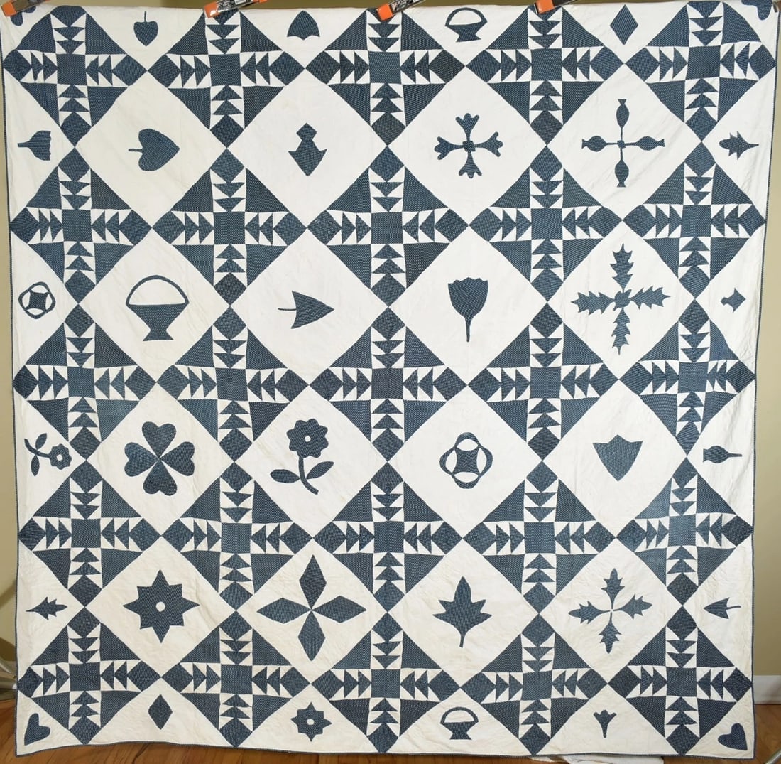Rare 1850's Indigo Blue & White Quilt: This MUSEUM QUALITY cotton 1840's/1850's indigo blue & white flying geese quilt is all hand pieced and hand quilted, with unusual appliqued charms in the background, including flowers, spade, shamrock