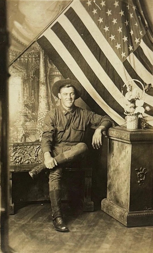 RPPC Real Photo Smiling Soldier in Uniform American Flag Patriotic Circa 1900: Real photo patriotic postcard of a soldier in uniform with a large American Flag in the background. Image is clear and card is in very good shape. Postally unused. Circa 1900 - 1909. 