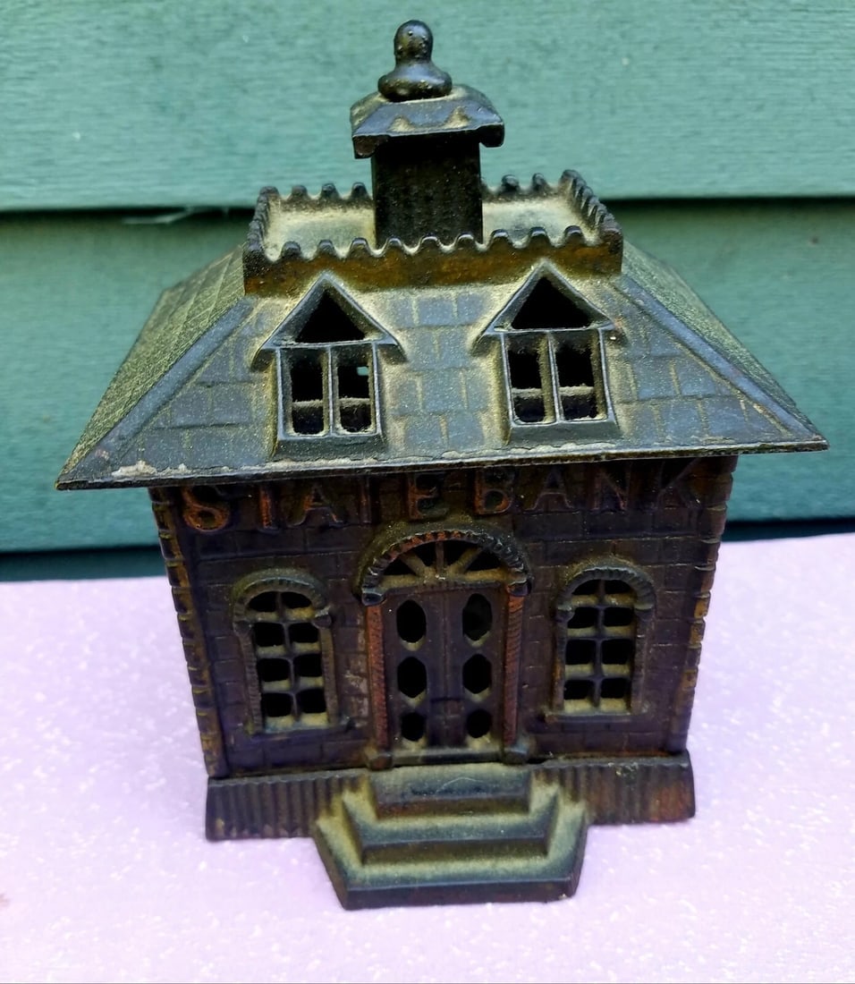 Figural state bank cast iron great original condition: Great looking piece in Excellent condition. Roof line measures 3 1/2 x 4 1/2". 6" tall Shipping charges include insurance. Shipping:Domestic: Flat-rate of $20.00 to anywhere within the contiguous
