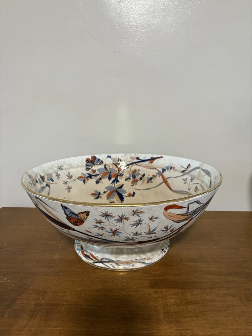 Ridgeways English Flow Blue Punch: It measures 15 1/2” x 6 3/4” and is marked. It has a tight 3 1/2” hairline and it has some discoloration. Otherwise it has no other issues Shipping:Domestic: Flat-rate of $40.00 to