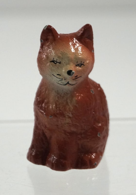 Antique Sitting Kitten Cat Cast Iron Paperweight #1: Title: Antique Sitting Kitten Cat Cast Iron Paperweight #1Dimension: 1 3/4” tall x 7/8” wideDate: Ca. 1940’s-50’s.Additional Information: Full-figure, solid casting cast iron