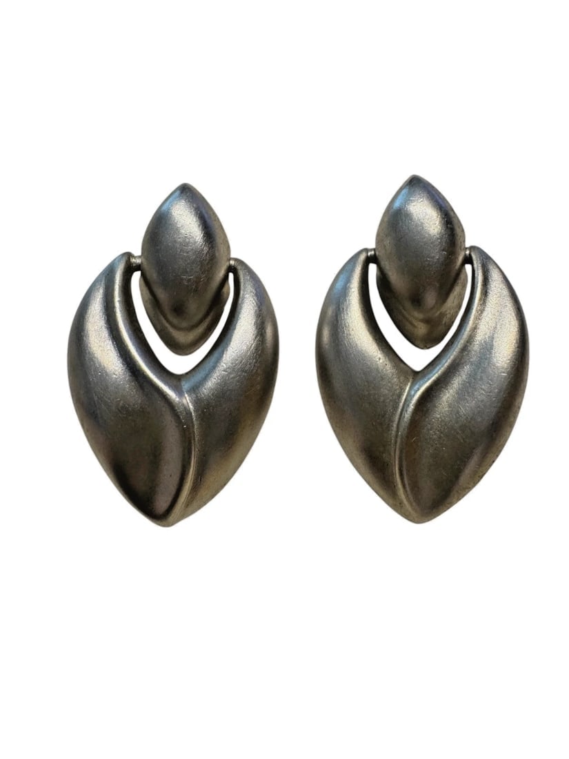 VTG Signed Givenchy Paris Silver satin nickel Dangle Pierced Earrings: These vintage Givenchy silver satin nickel dangle pierced earrings are a timeless piece of fashion jewelry. Signed by the renowned brand, these earrings feature a drop/dangle style with a sleek