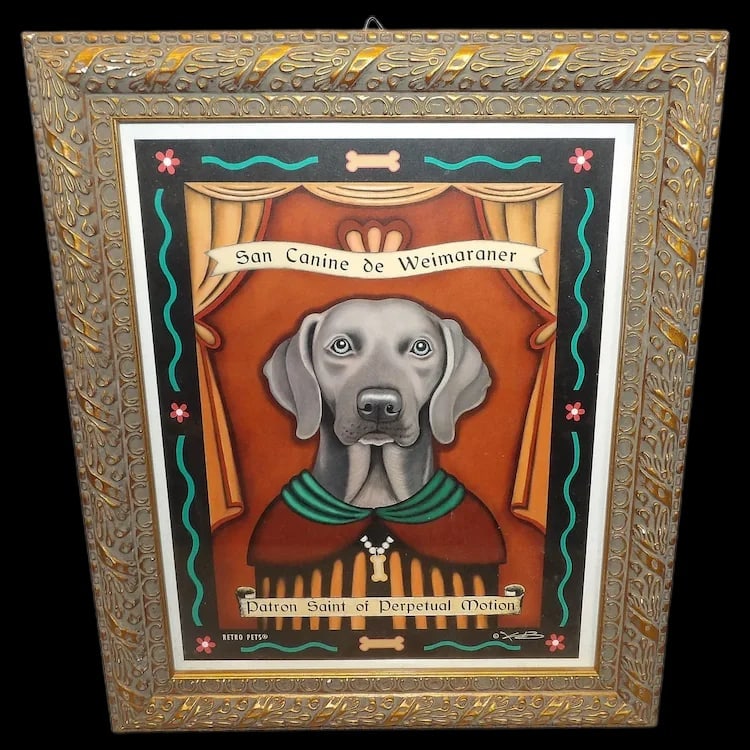Retro-Pets San Canine de Weimaraner Framed Picture: Framed Weimaraner portrait by Krista Brooks for Retro-Pets. Excellent condition, measuring 9-3/4” x 11-3/4”. Whimsical 'San Canine' religious-style dog art theme. Shipping: Domestic: Flat-